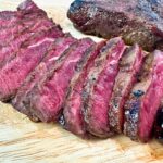 sliced steak on a cutting board