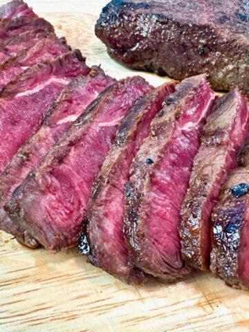 sliced steak on a cutting board