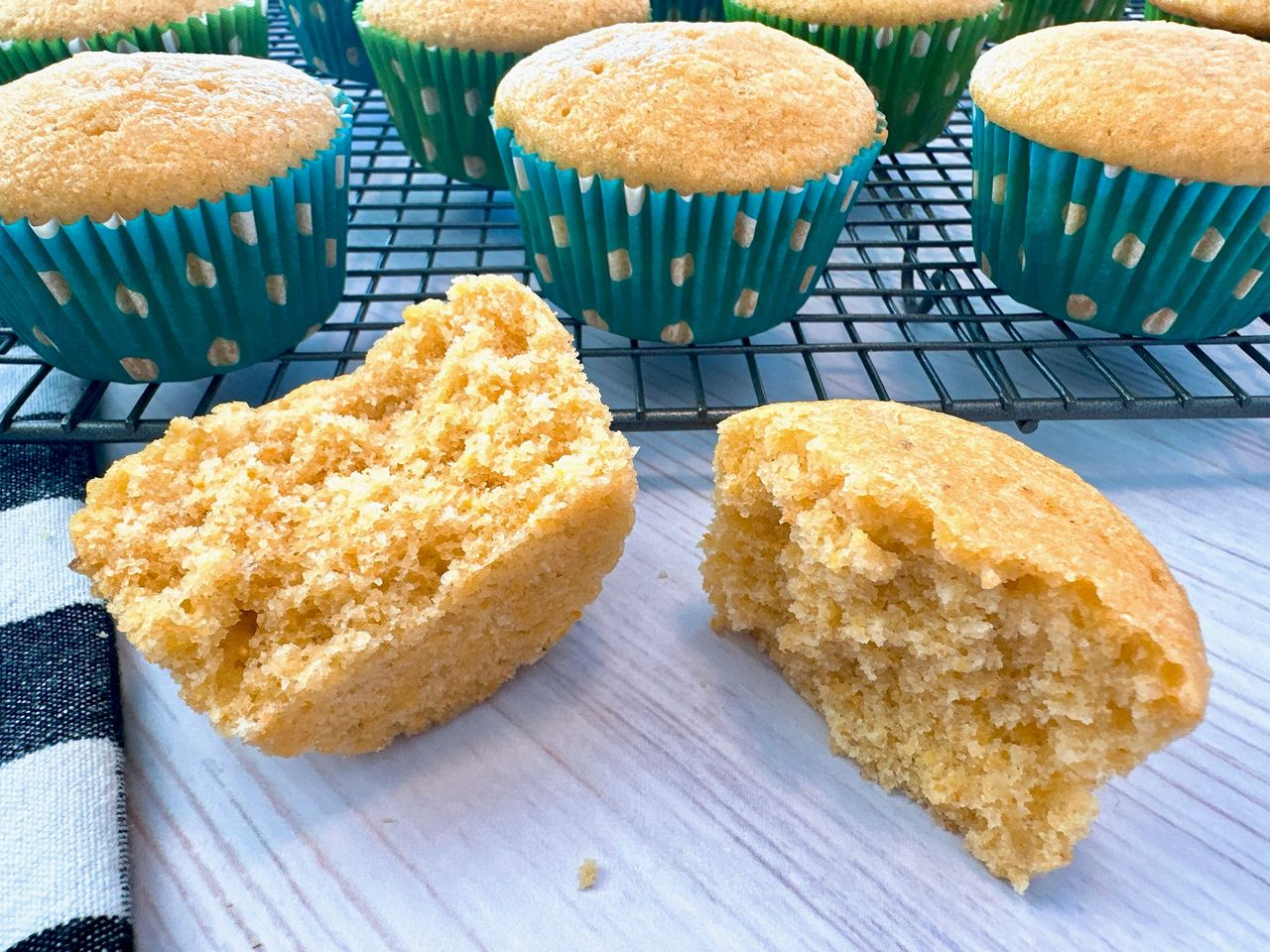 cornbread muffins on a wire rack and white counter