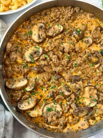 ground beef and mushrooms in a skillet