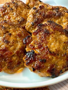 sausage patties on a white plate