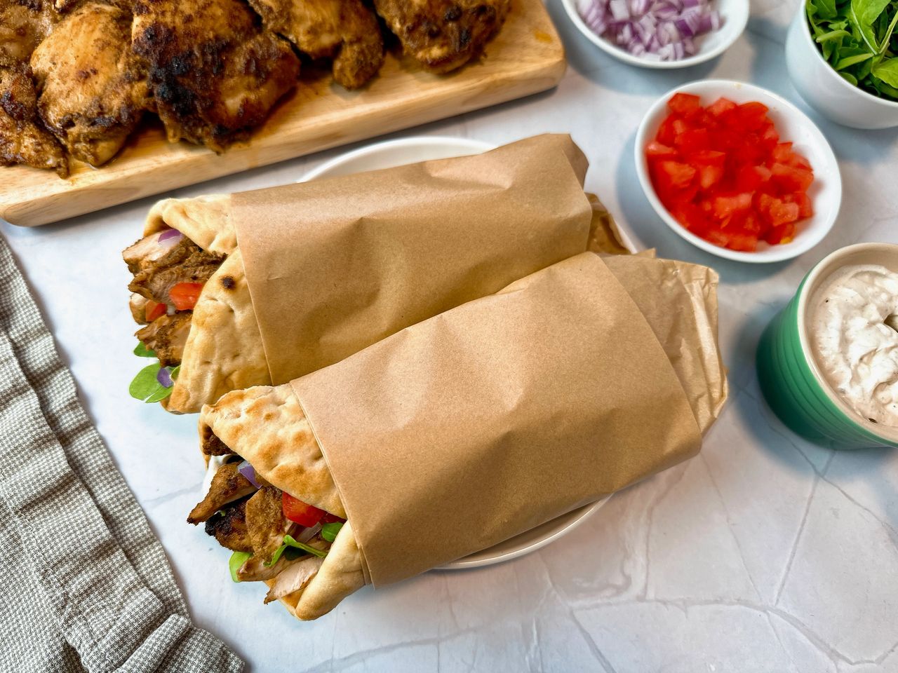 chicken shawarma wraps on a white plate