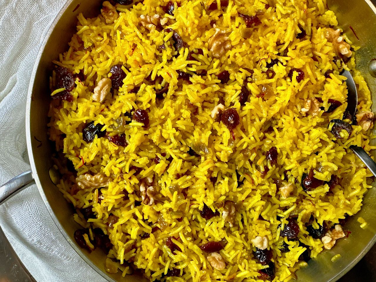 Rice Pilaf with Cranberries and Nuts rice pilaf with cranberries in a skillet