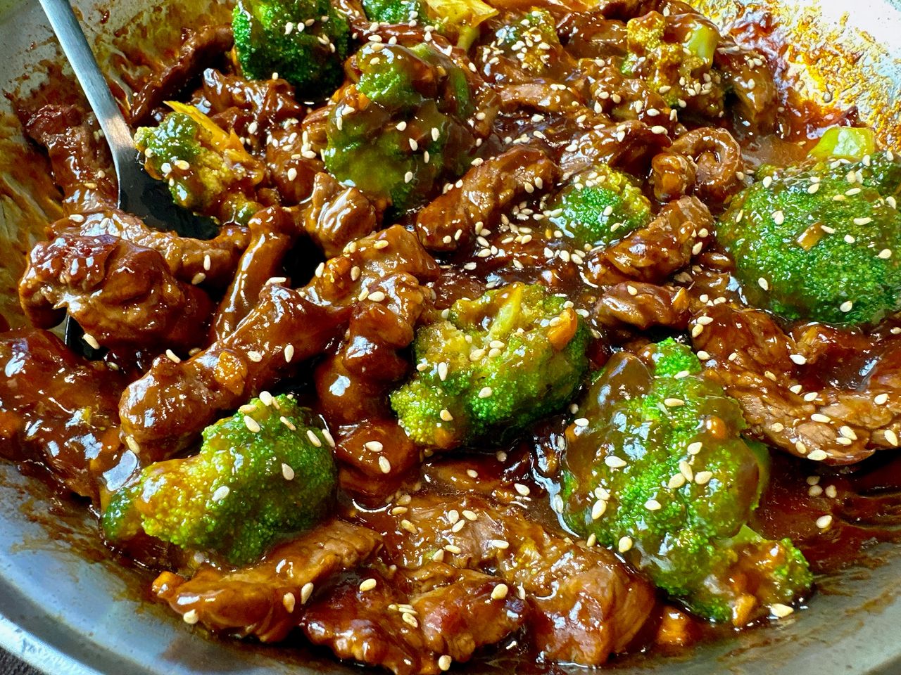 beef and broccoli in a skillet