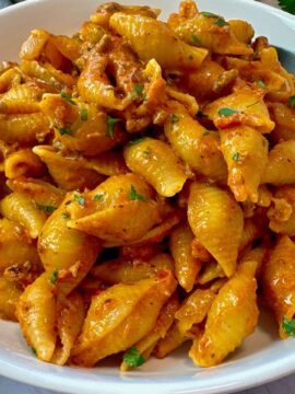 beef and pasta in a white bowl