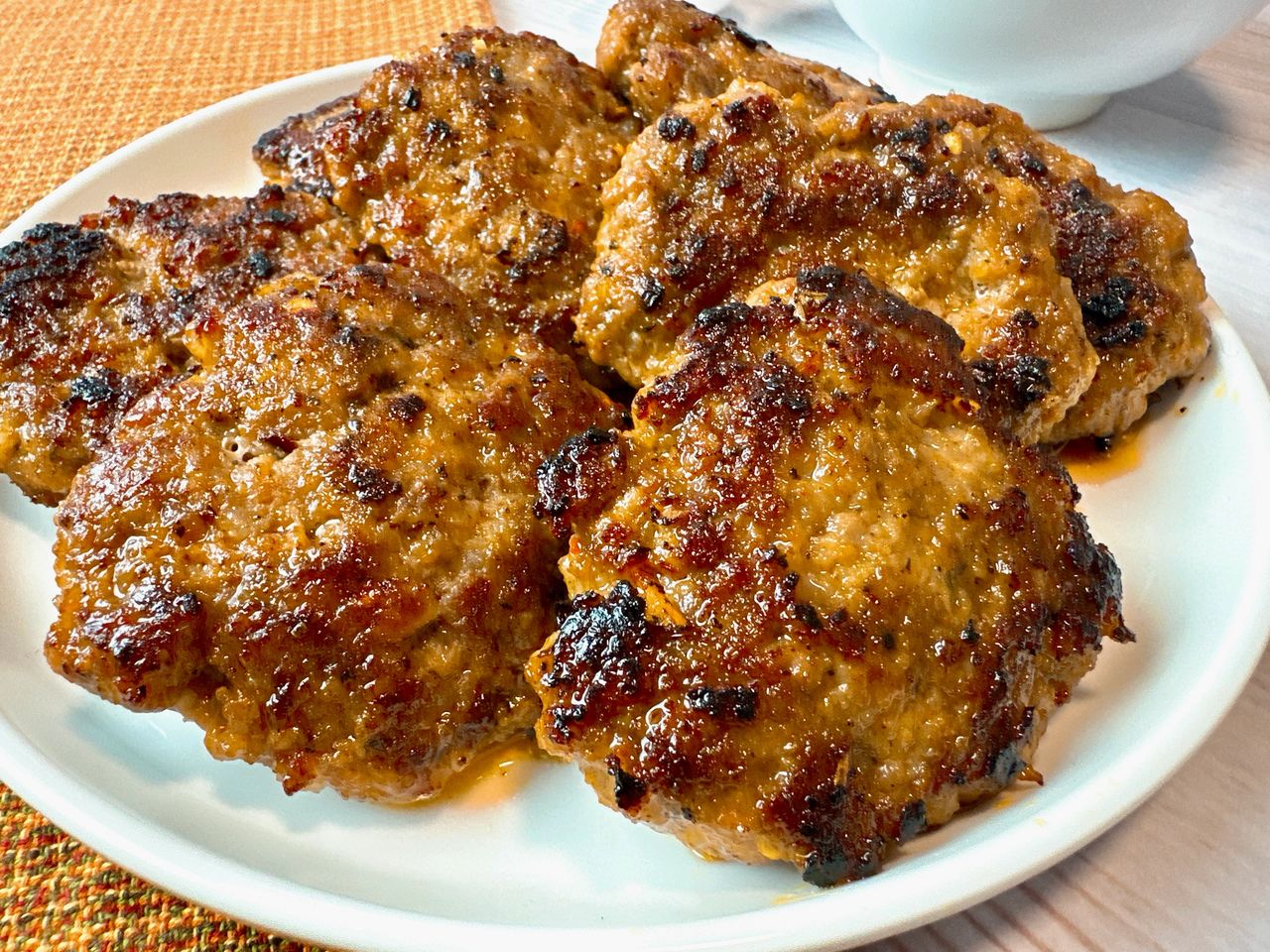 sausage patties on a white plate