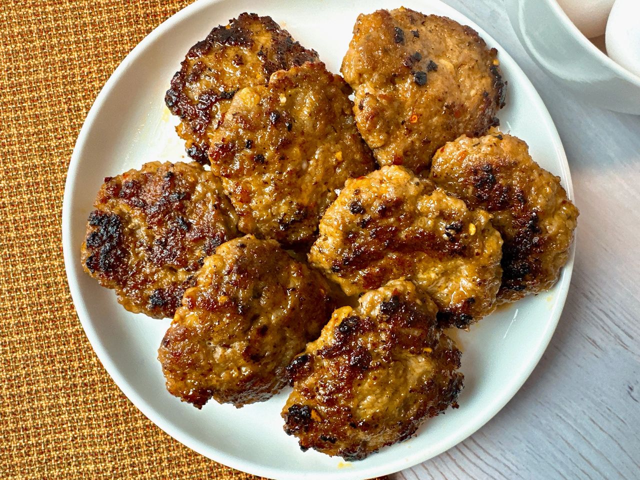 sausage patties on a white plate