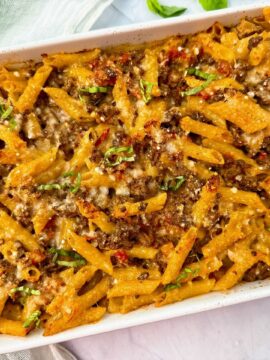 pasta and beef in a white baking dish