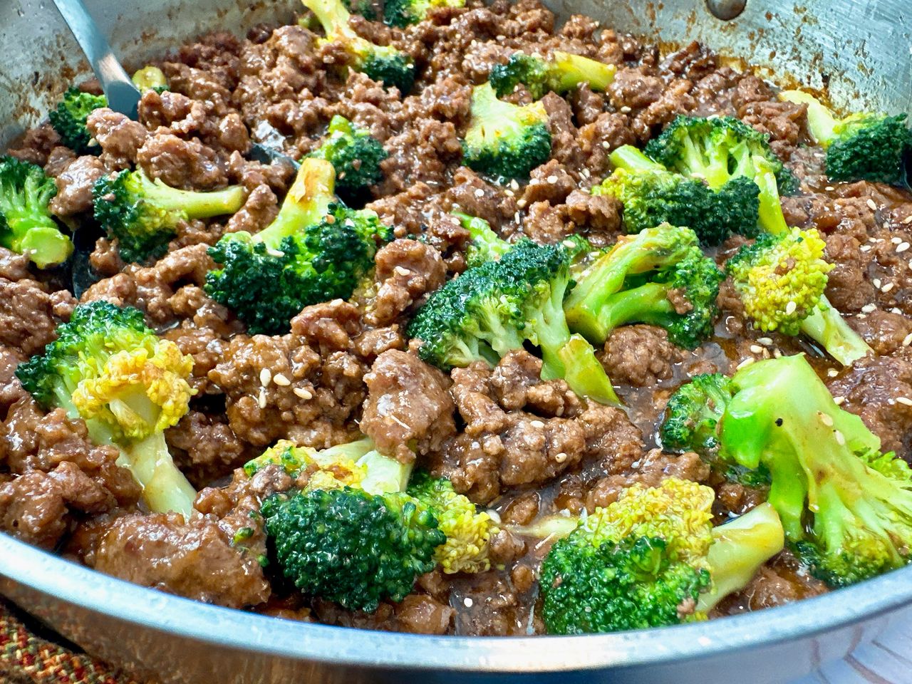 beef and broccoli in a skillet