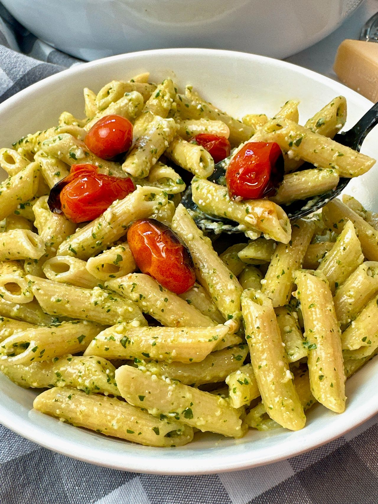 penne pasta with pesto and blistered tomatoes