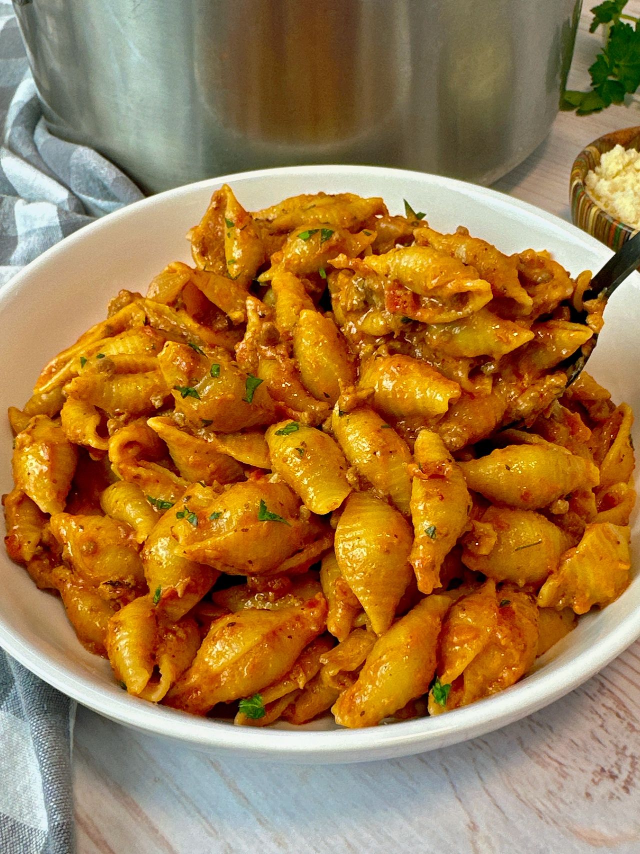 beef and pasta in a white bowl