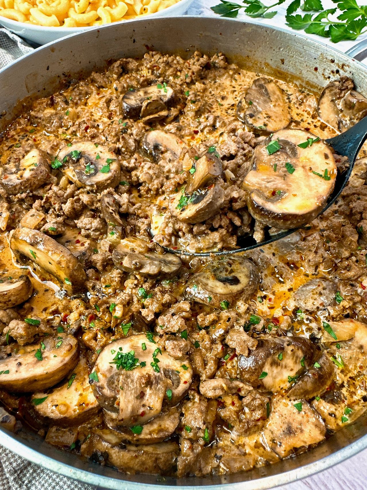 ground beef and mushrooms in a skillet