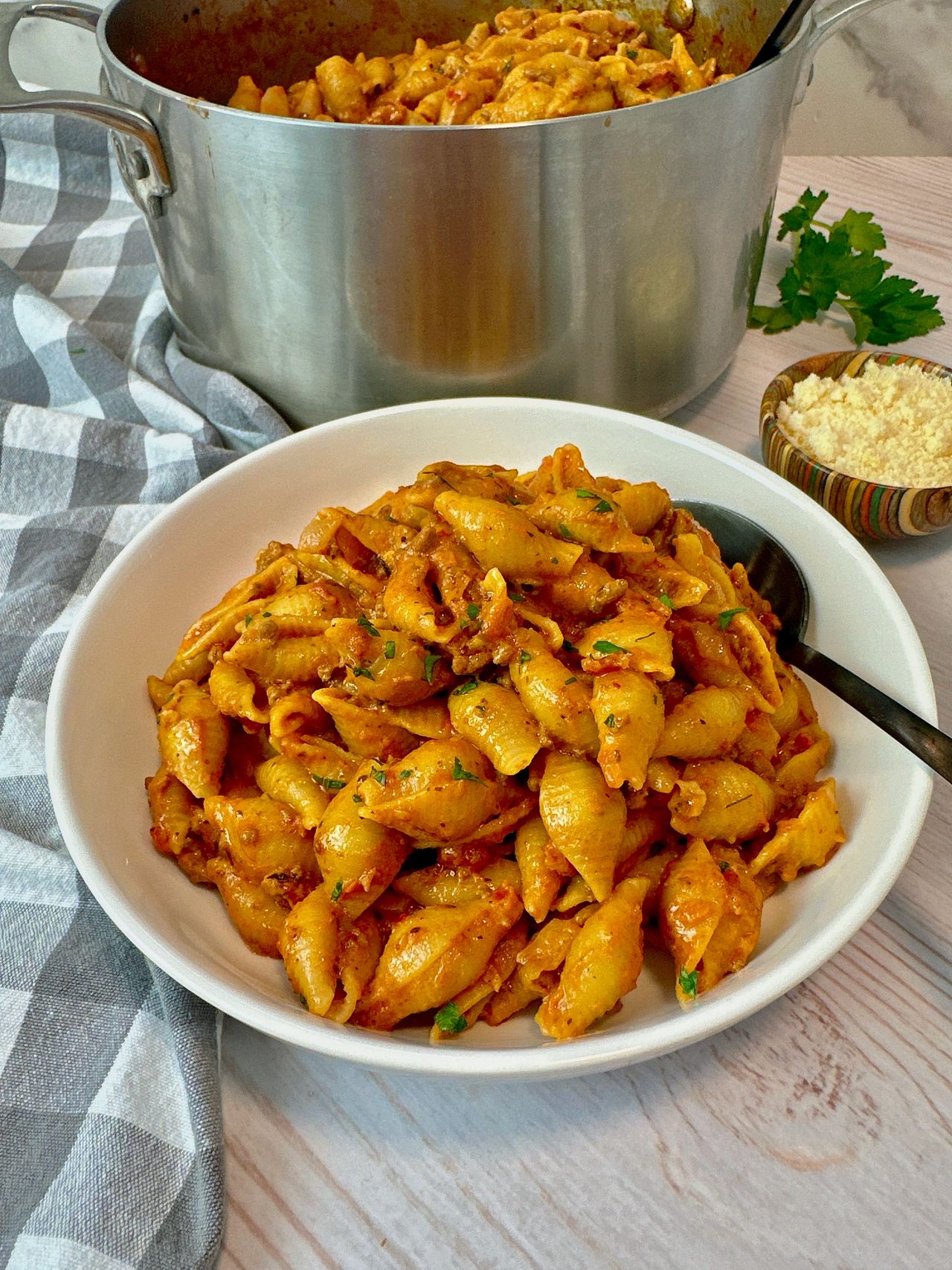 beef and pasta in a white bowl