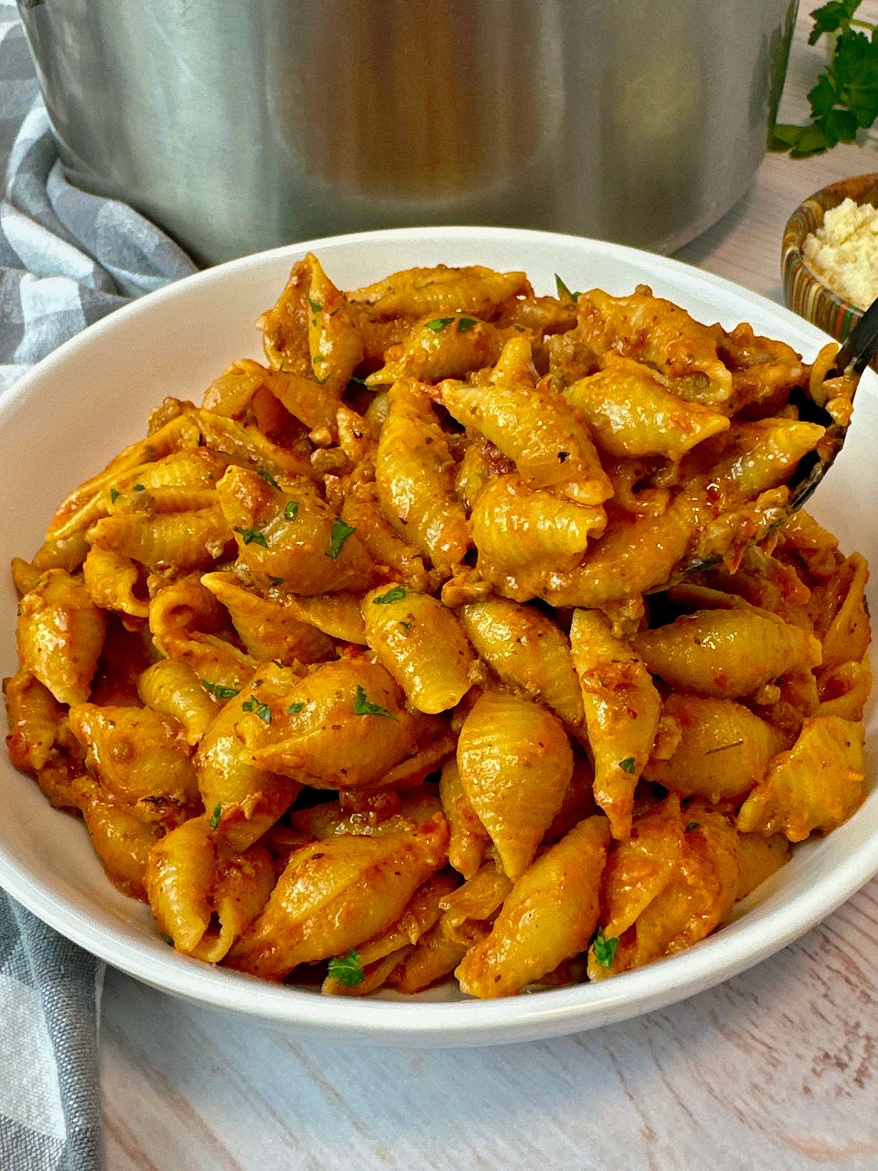 beef and pasta in a white bowl