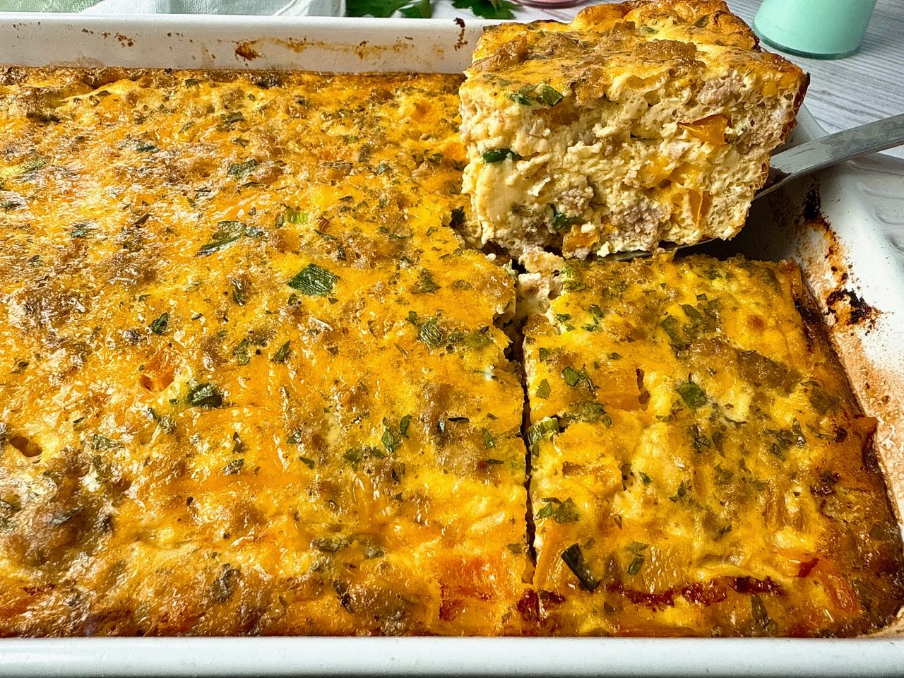 Breakfast Casserole Breakfast Casserole on a spatula in a white baking dish