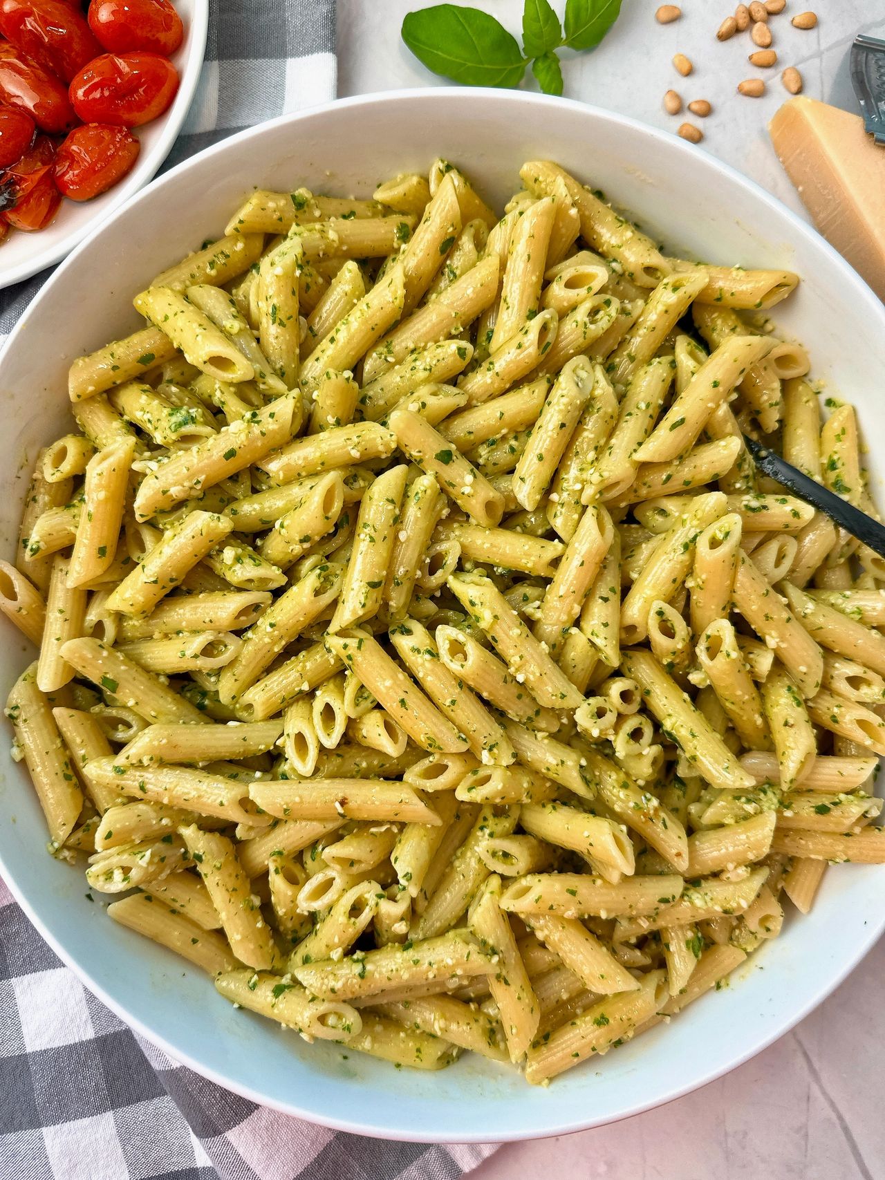 penne pasta with pesto and blistered tomatoes