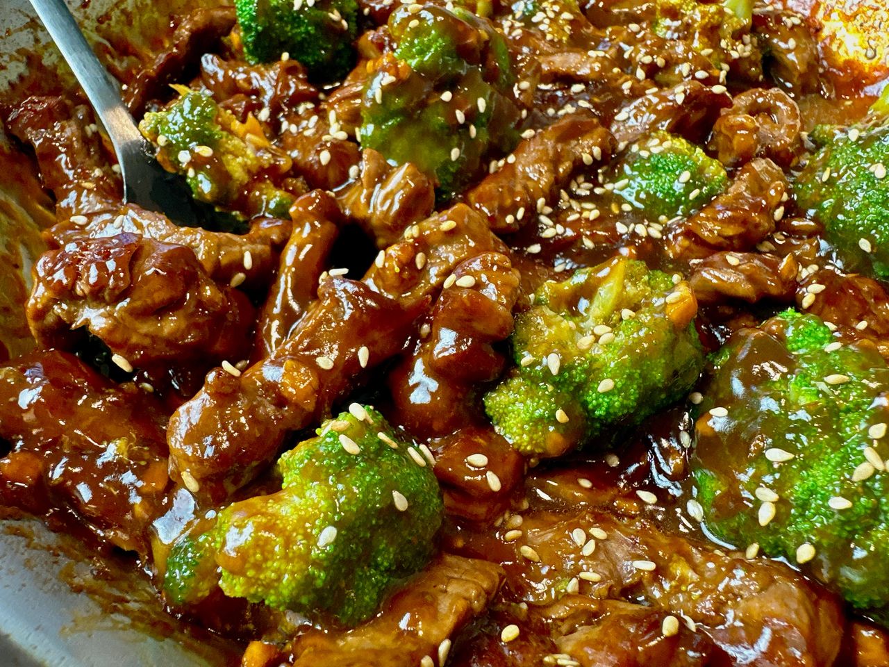 beef and broccoli in a skillet