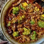 beef and broccoli in a skillet