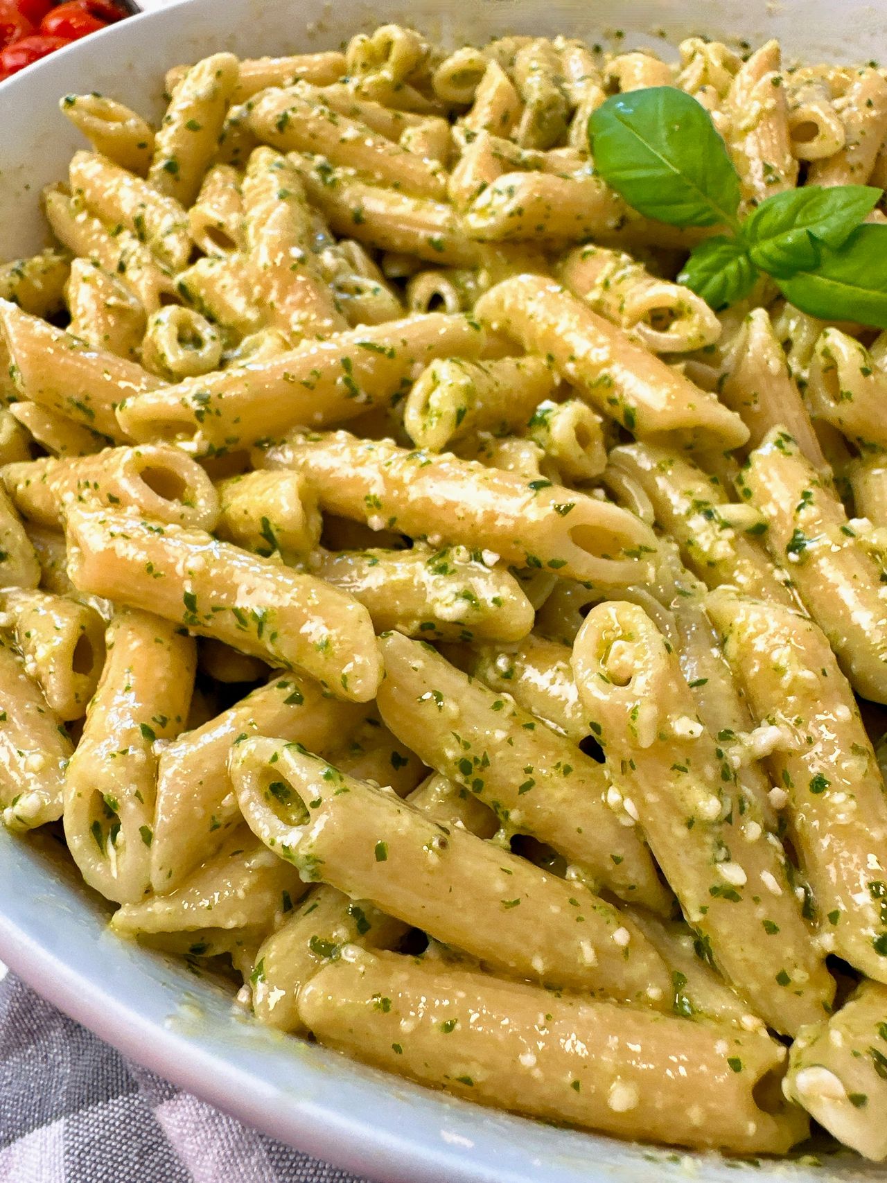 penne pasta with pesto and blistered tomatoes