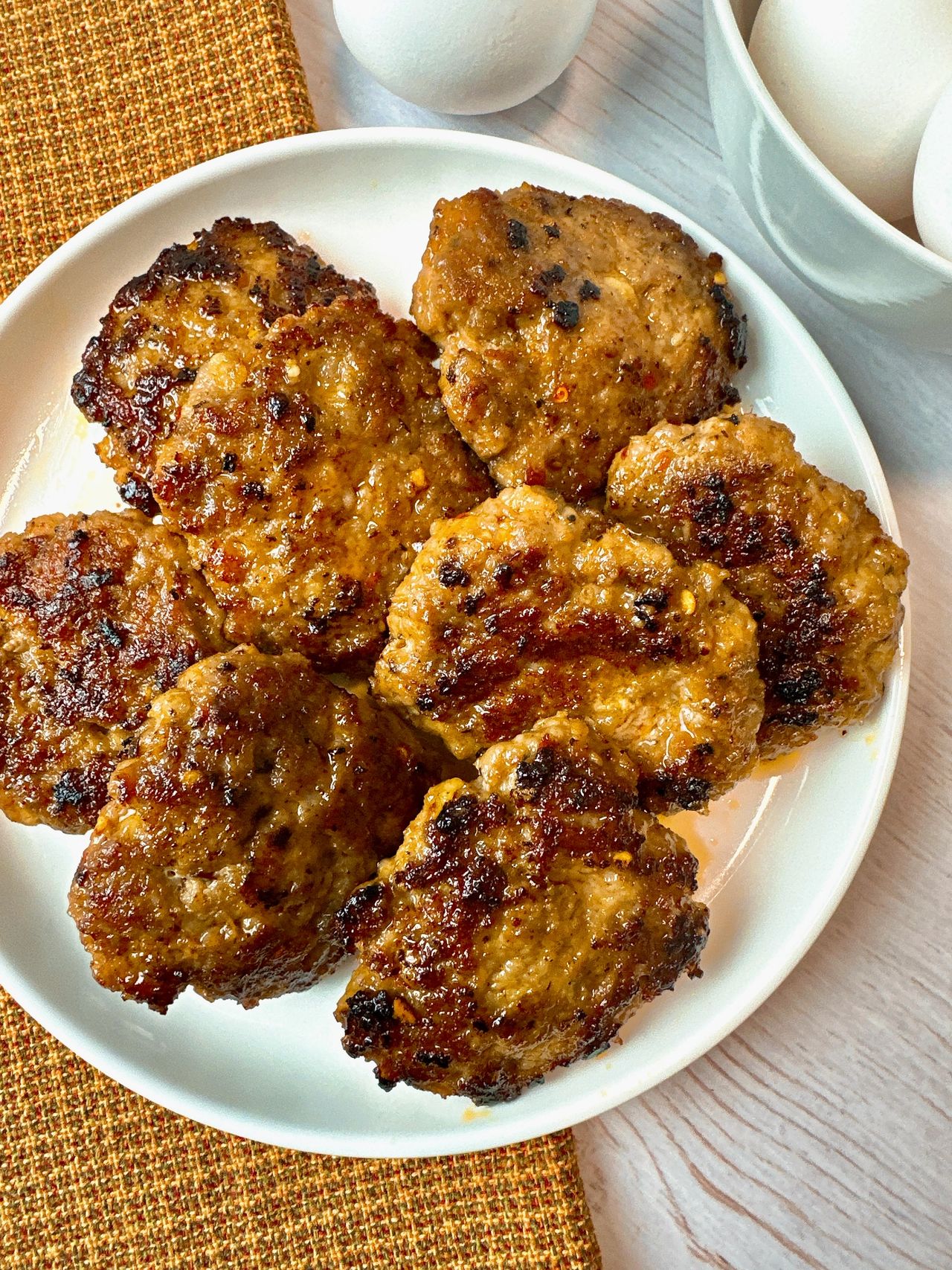 sausage patties on a white plate