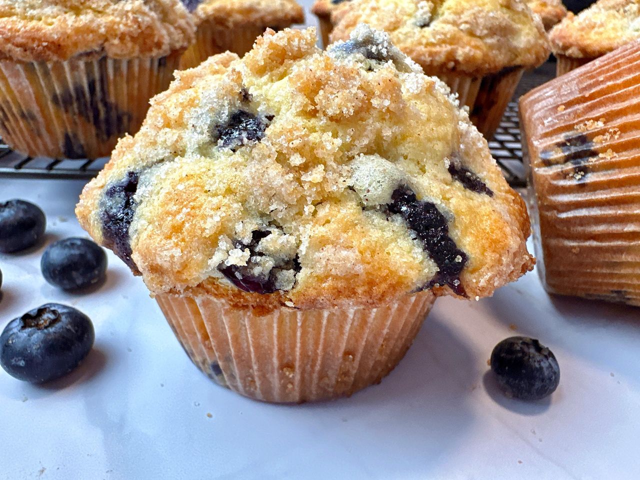blueberry muffins on a white counter
