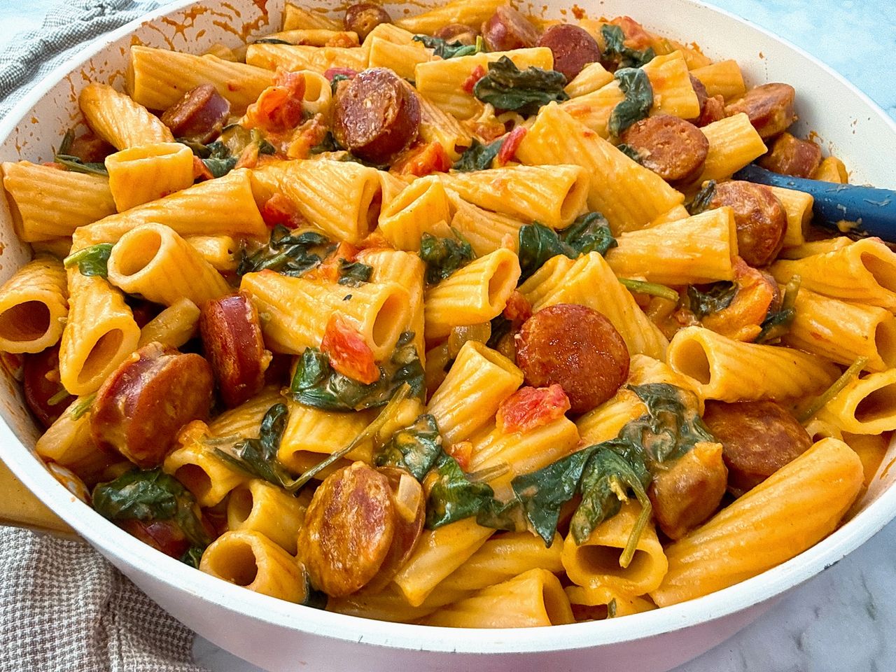 rigatoni with chorizo in a white skillet