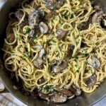 pasta with mushrooms in a skillet