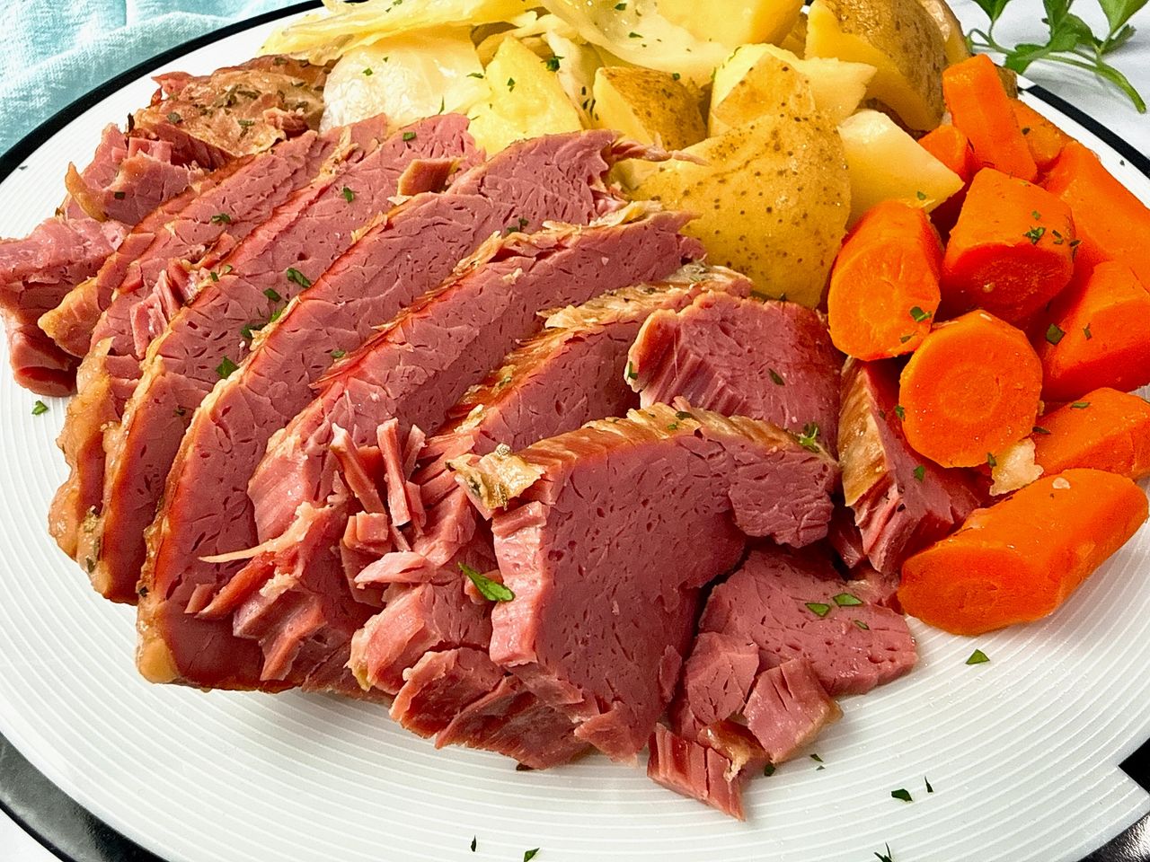 Corned Beef and Cabbage on a white serving platter