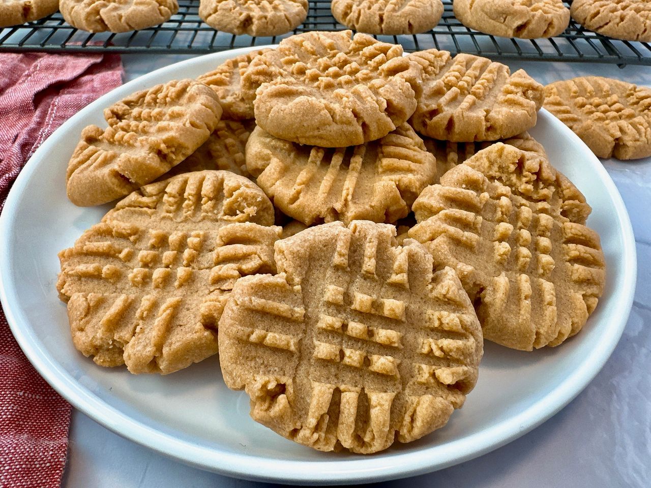 stacked peanut butter cookies on a white background