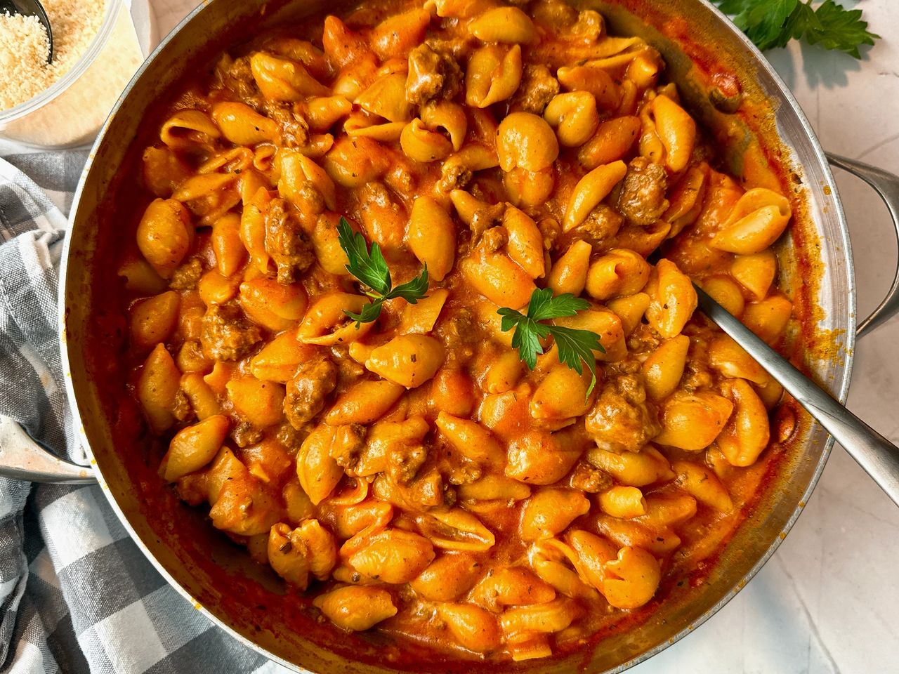 pot of pasta and beef with a spoon