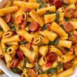 rigatoni with chorizo in a white skillet