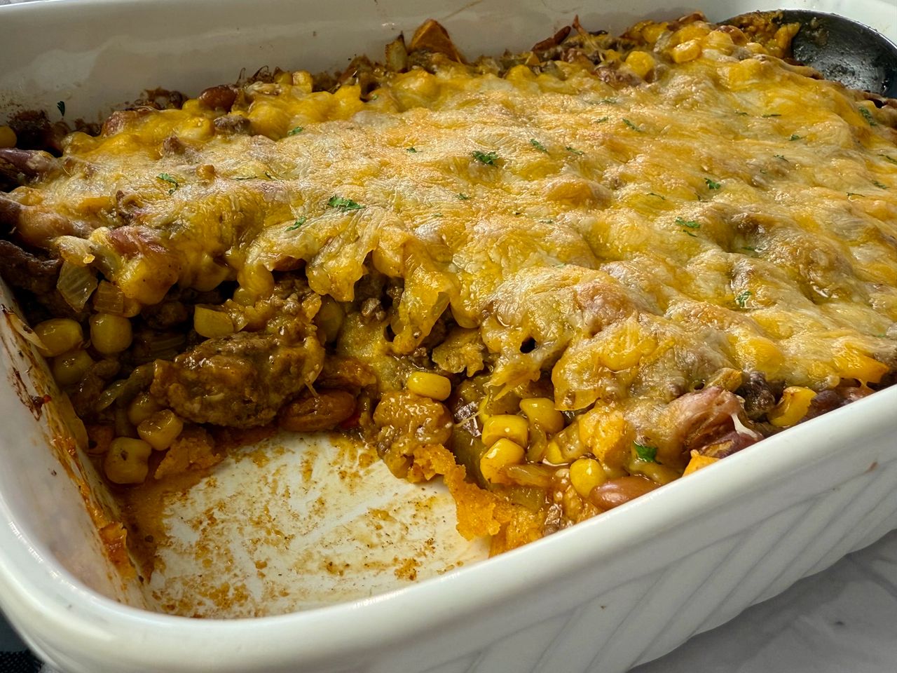 Baked Enchilada Casserole enchilada casserole in a white baking dish