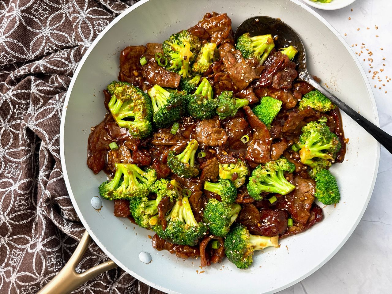 Beef and Broccoli beef and broccoli in a white skillet