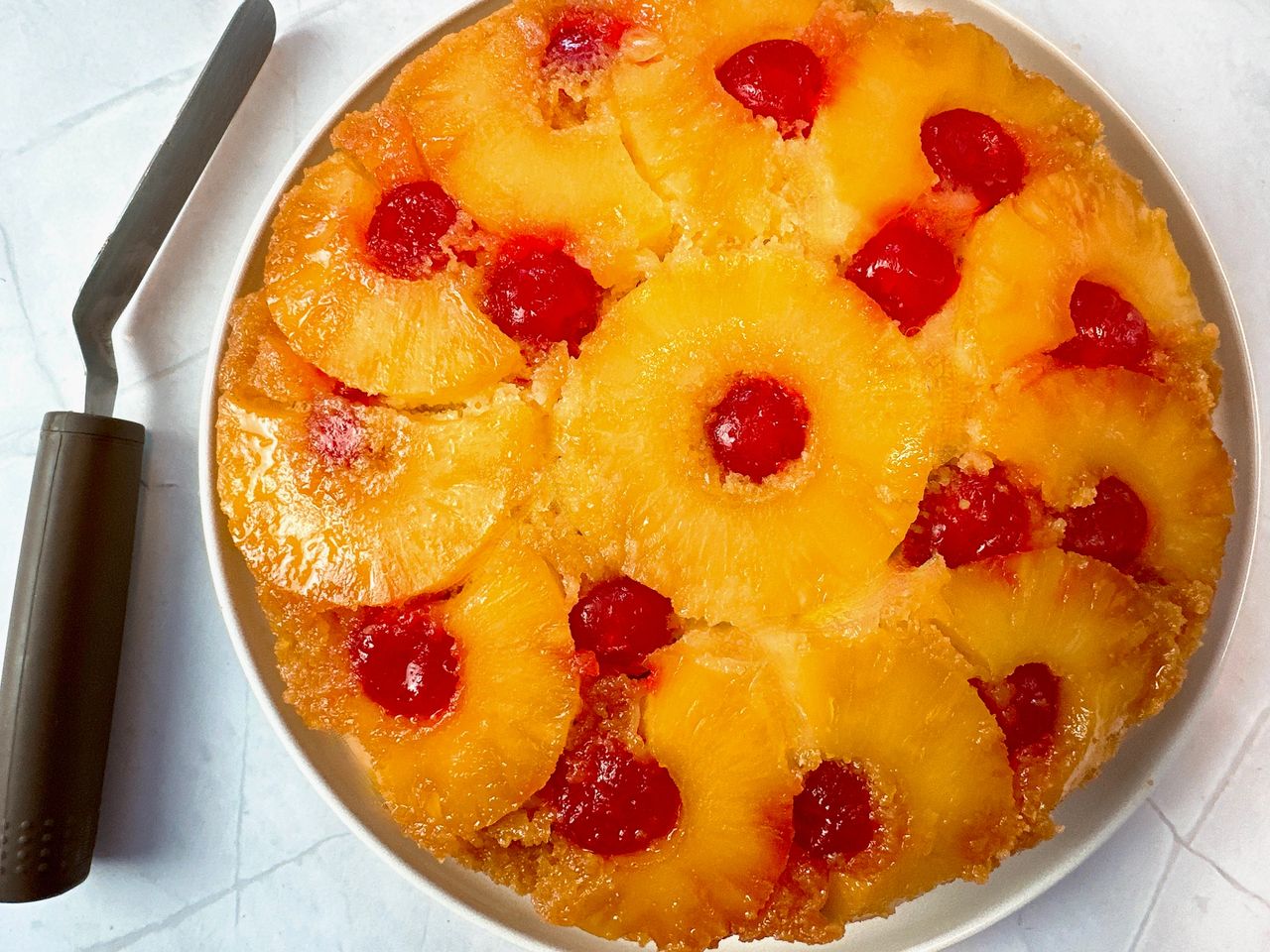 pineapple upside cake on a white plate