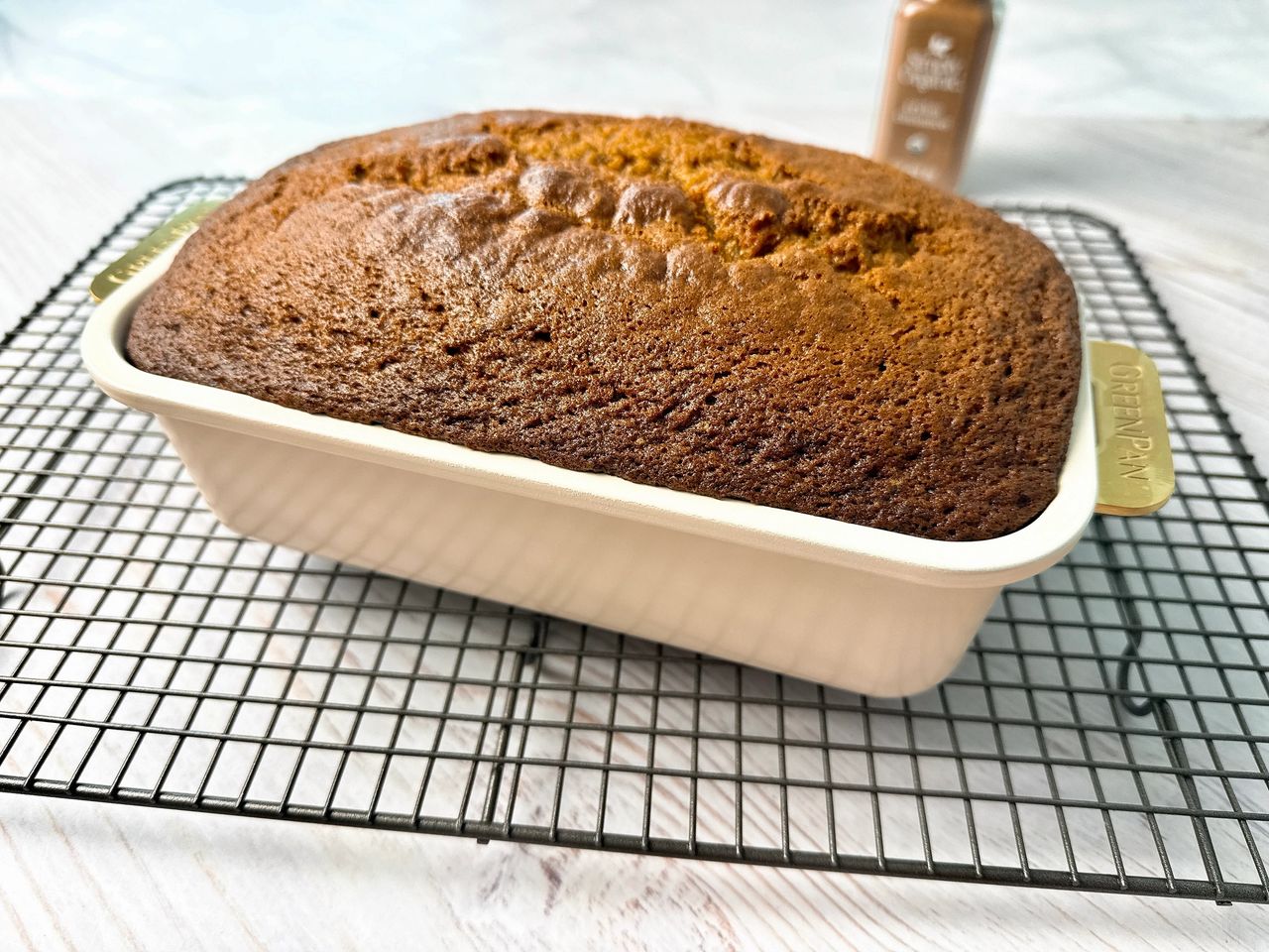 Pumpkin spice loaf in a white loaf pan