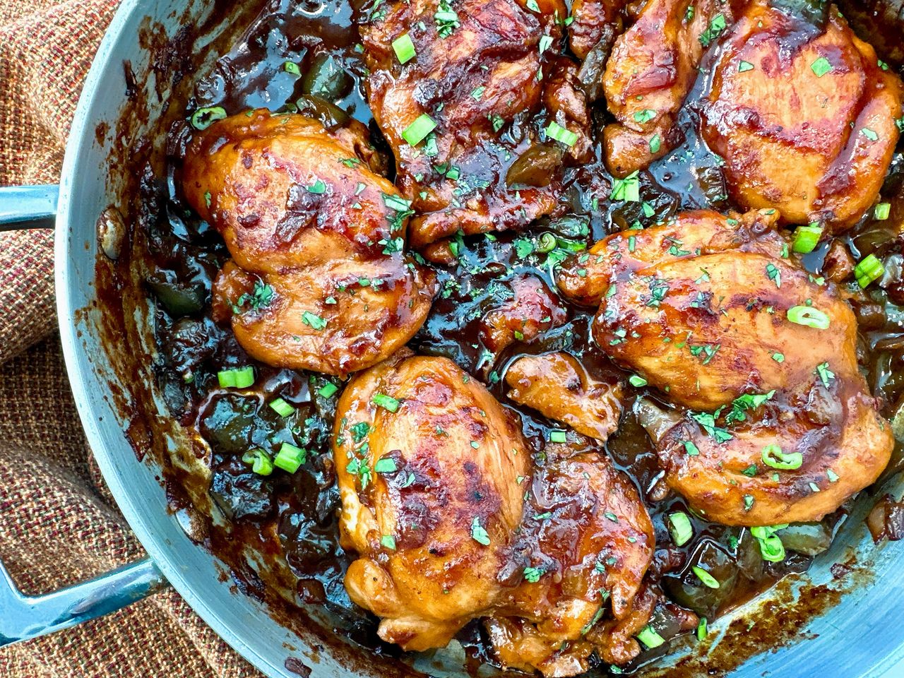 chicken thighs in a skillet with Asian glaze