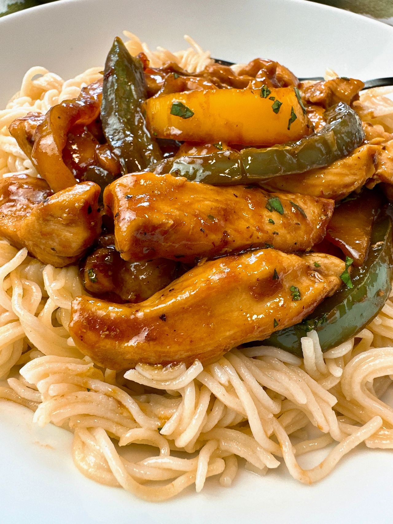 chicken stir fry over asian noodles
