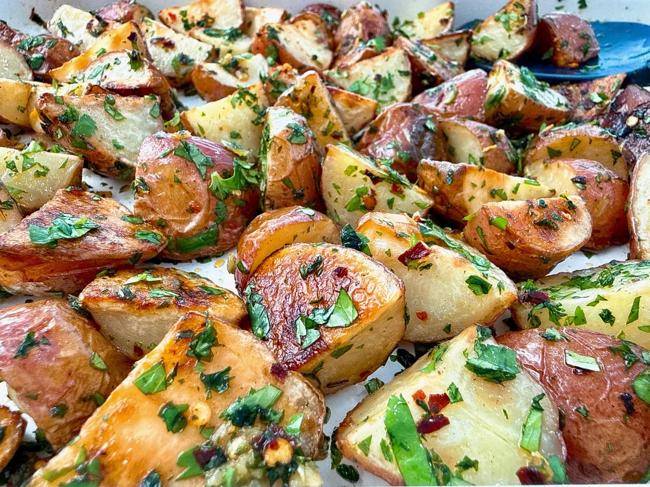 roasted potatoes on a white baking sheet