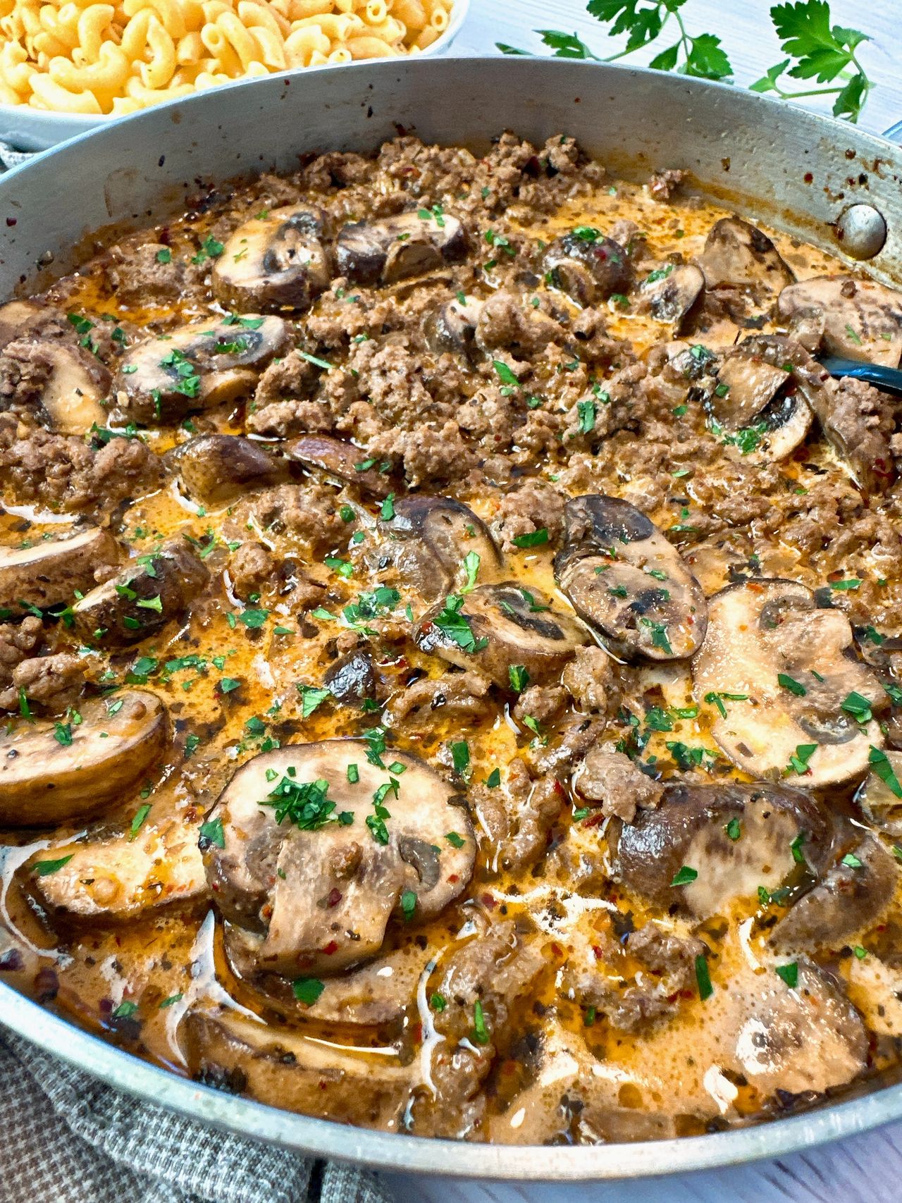 ground beef and mushrooms in a skillet