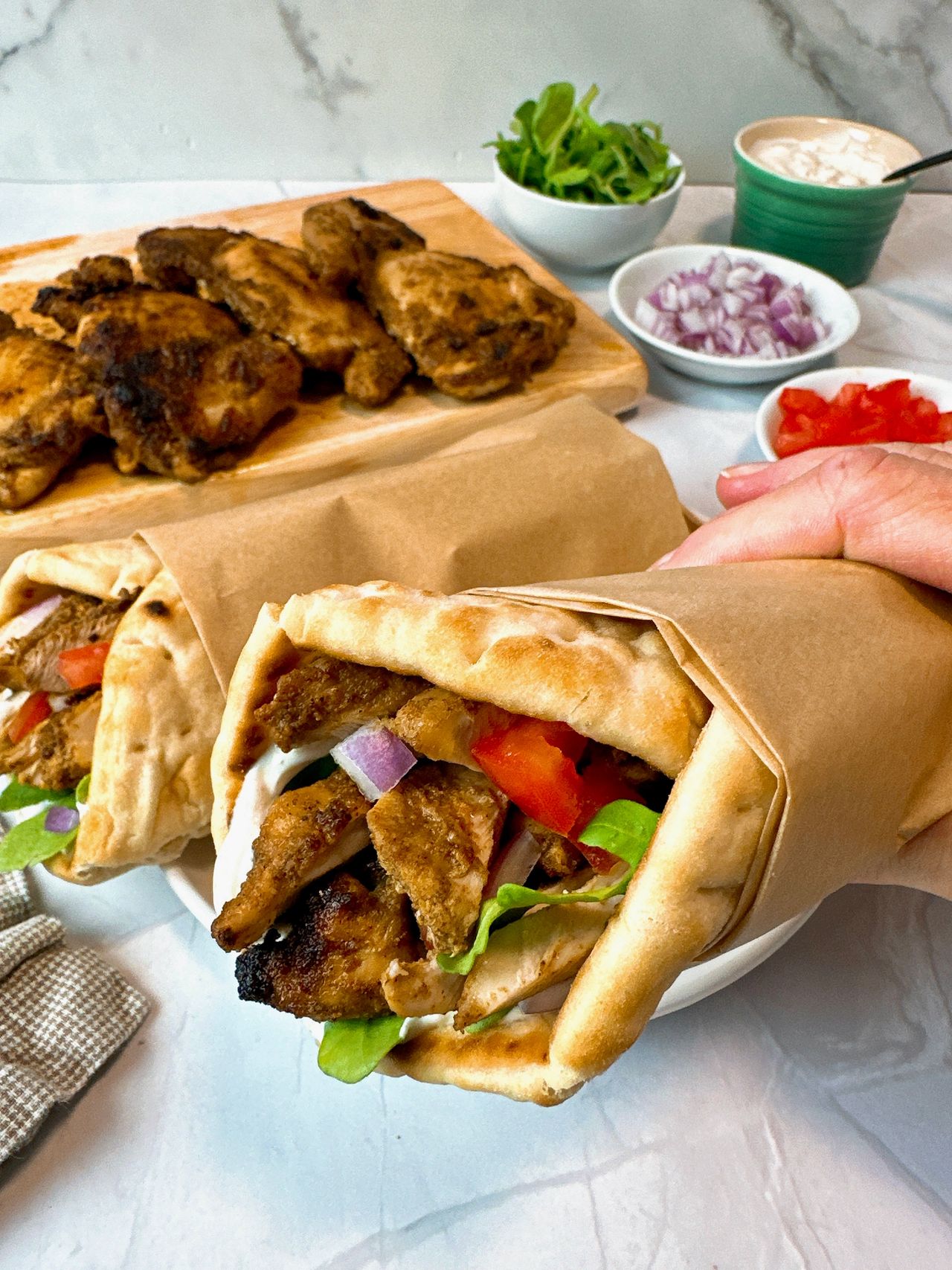 chicken shawarma wraps on a white plate