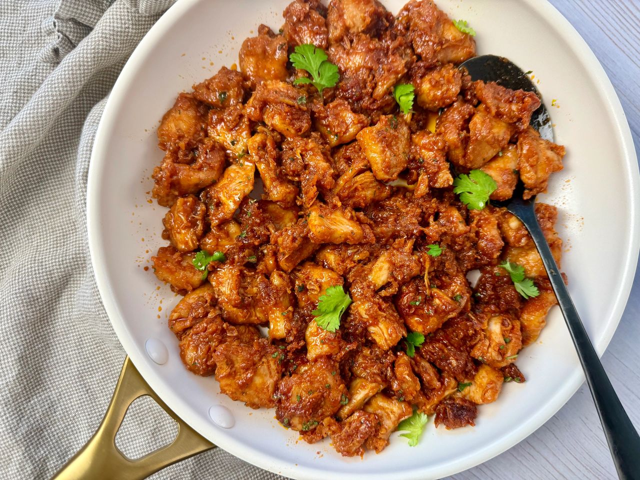 gochujang chicken in a white skillet
