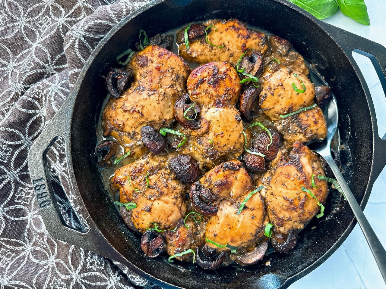 Balsamic Chicken balsamic chicken and mushrooms in a cast iron skillet
