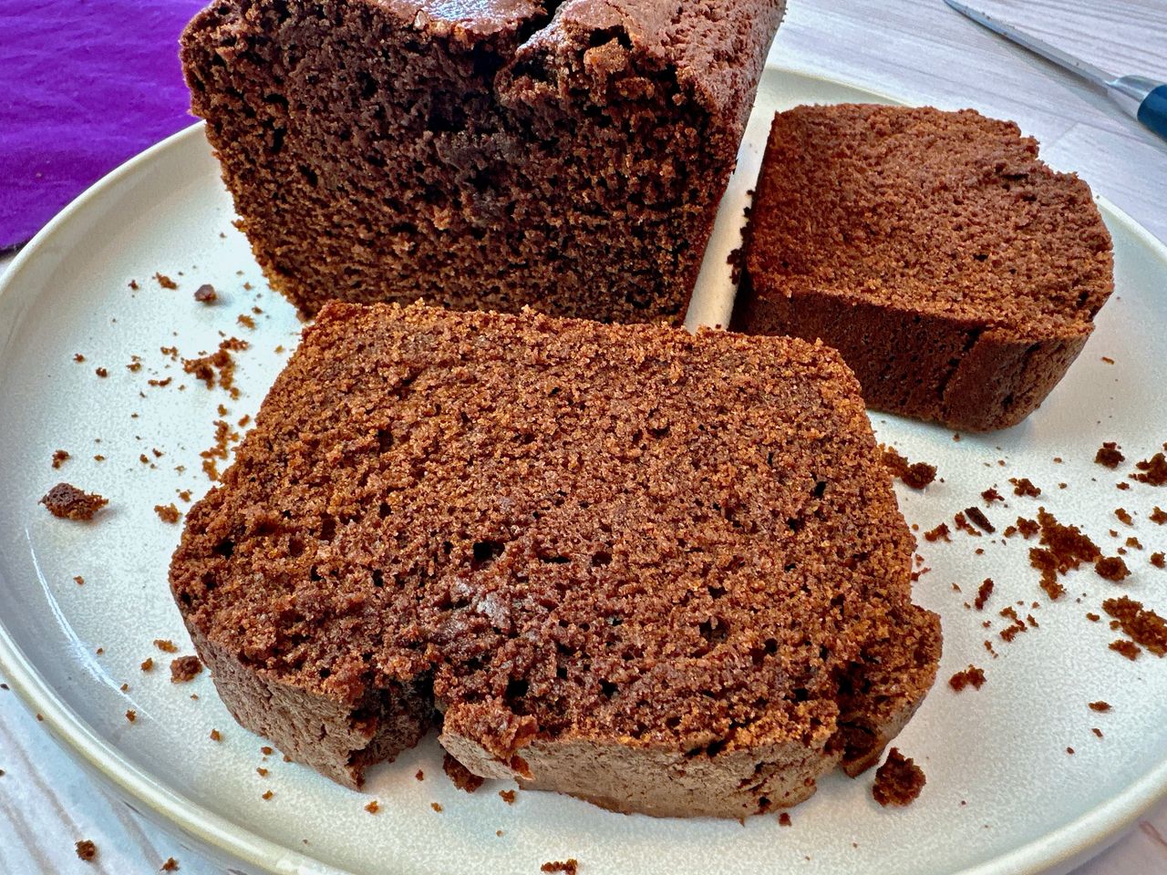 chocolate loaf cake slices on a white plate