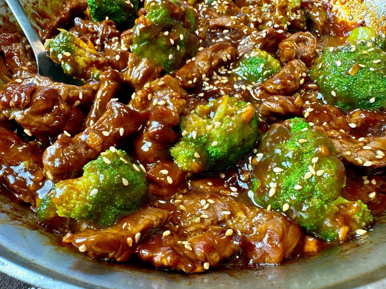 beef and broccoli in a skillet