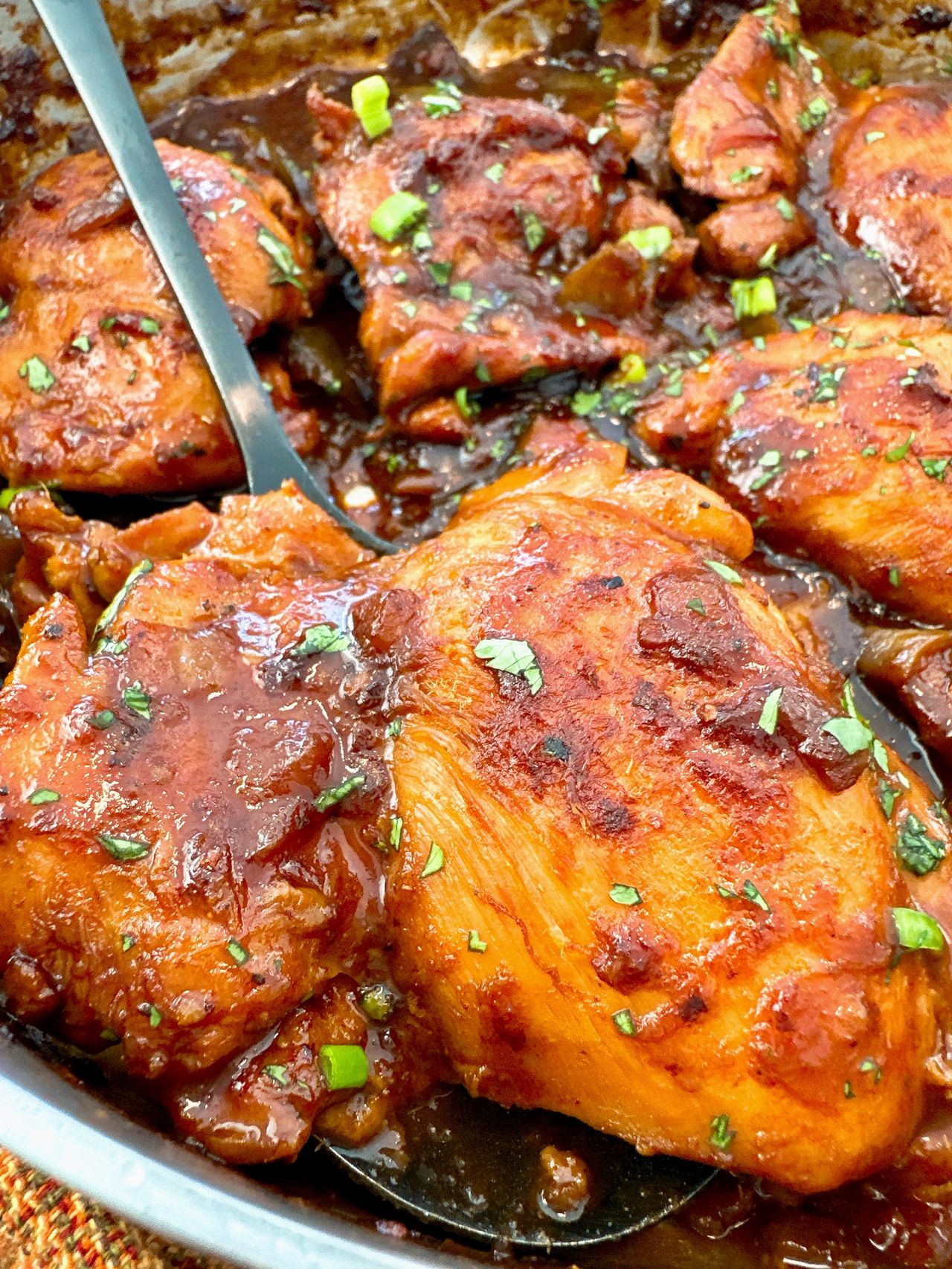 chicken thighs in a skillet with Asian glaze