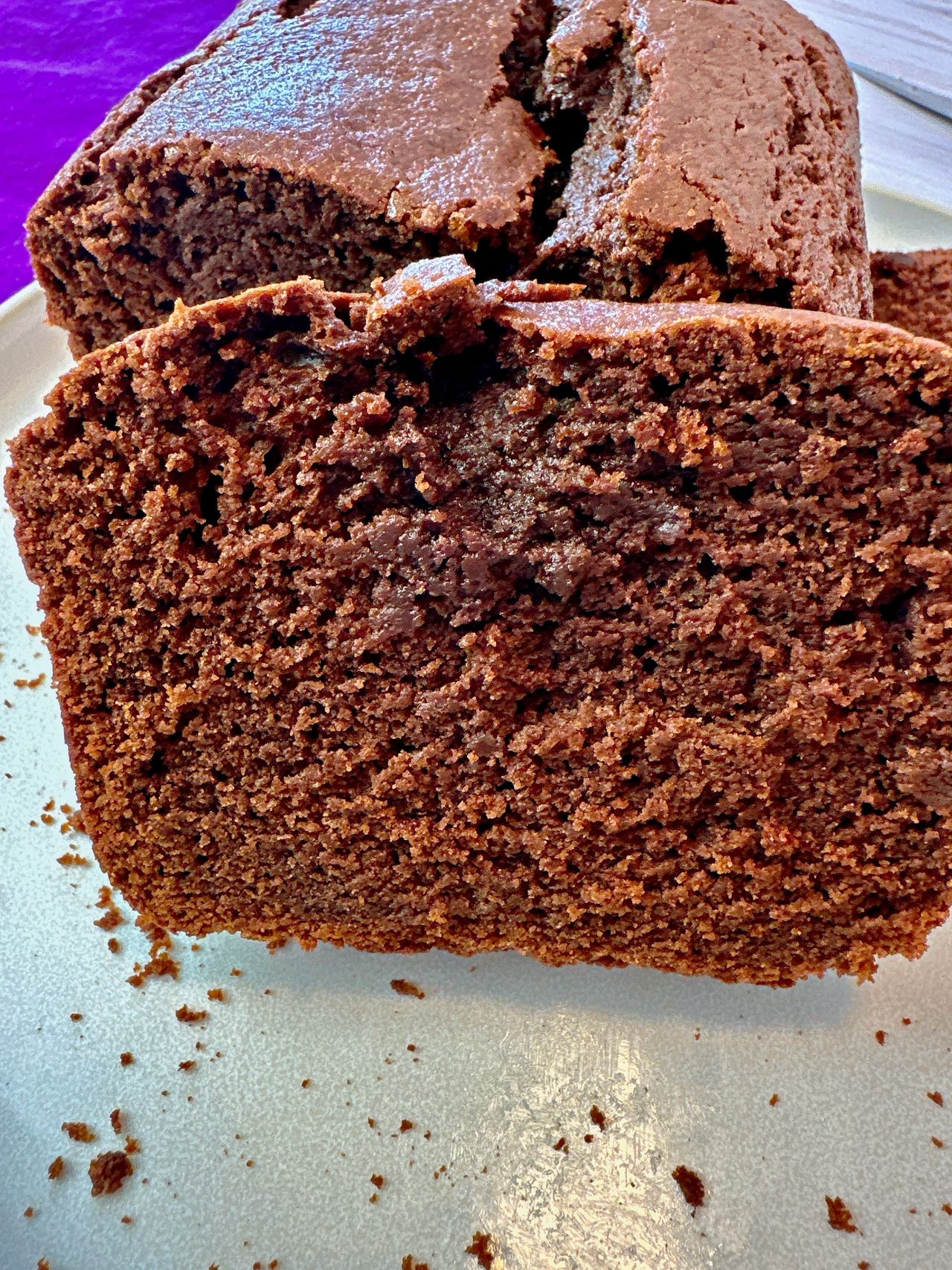 chocolate loaf cake slices on a white plate