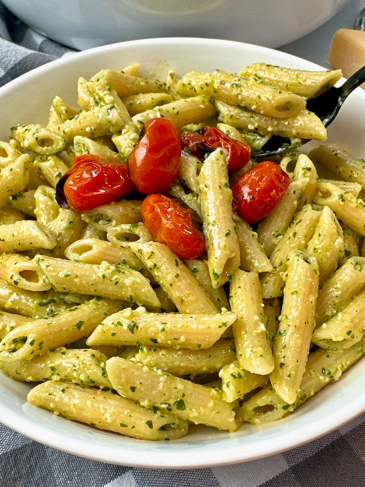 penne pasta with pesto and blistered tomatoes