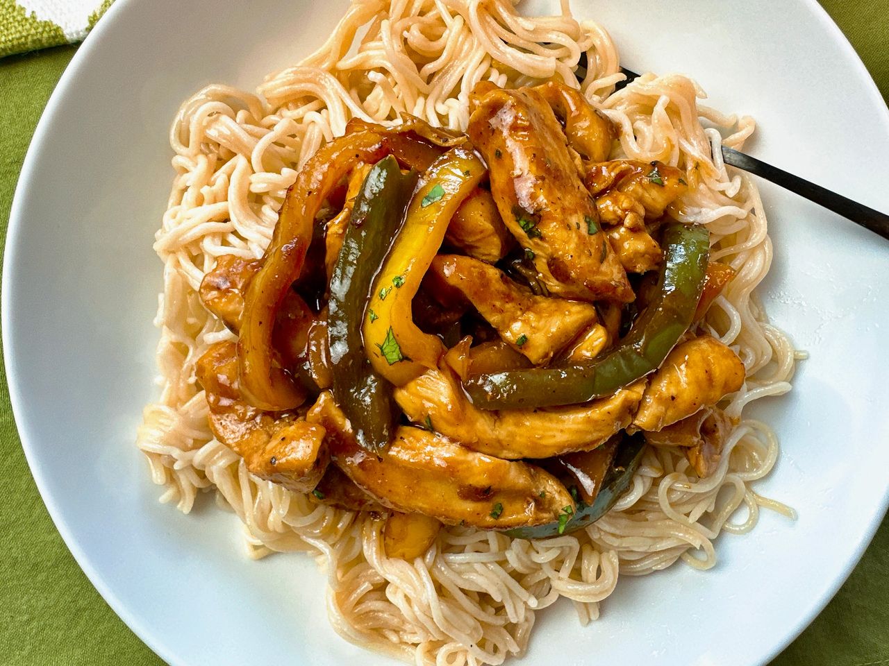 chicken stir fry over asian noodles