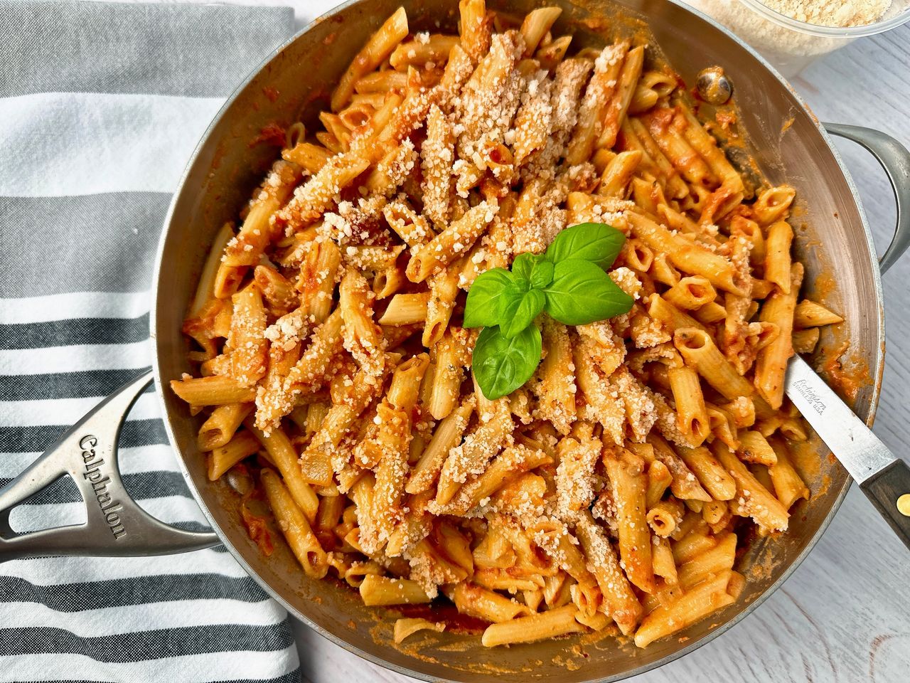 pasta in tomato cream sauce in a silver pan