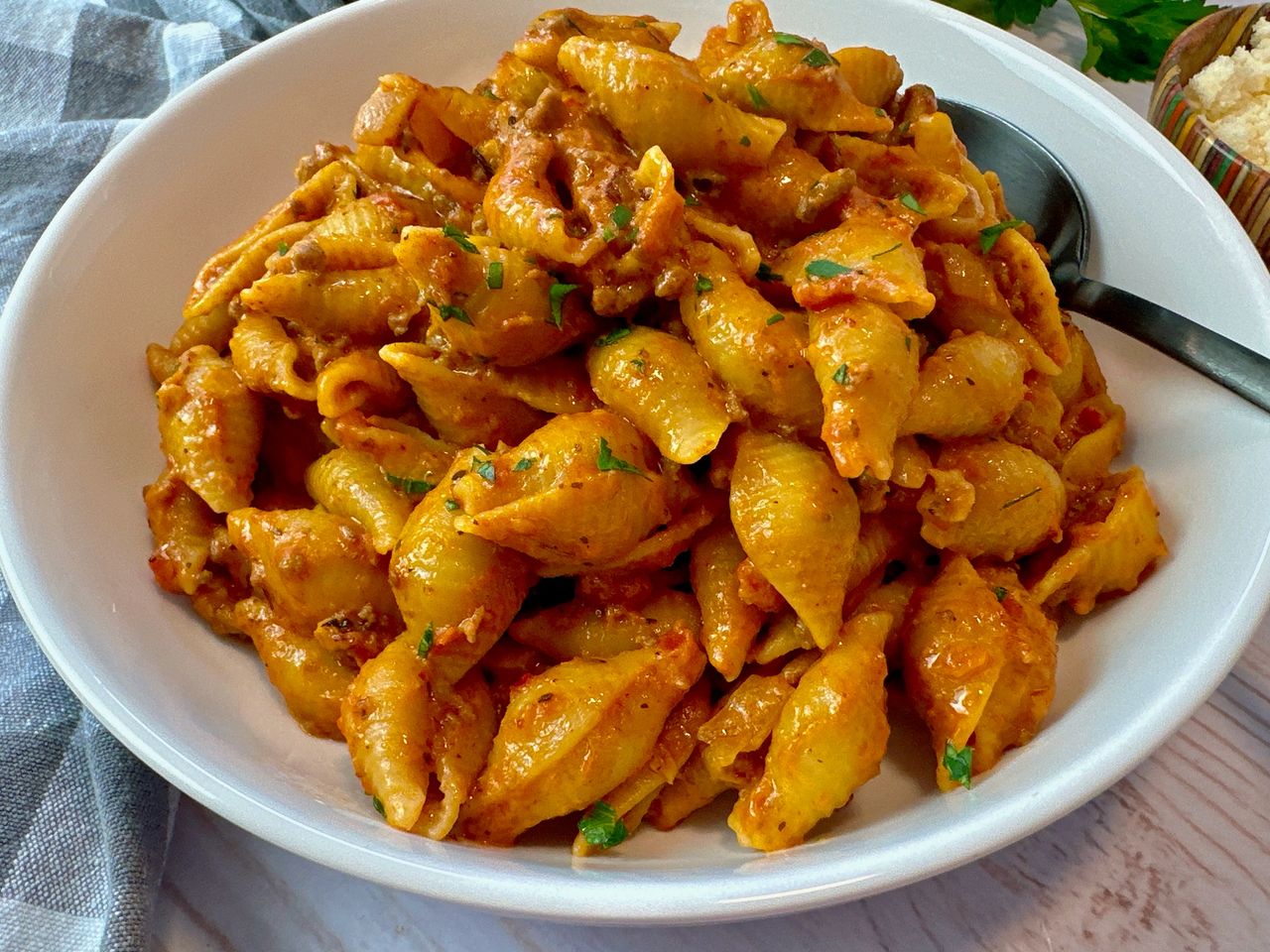 beef and pasta in a white bowl